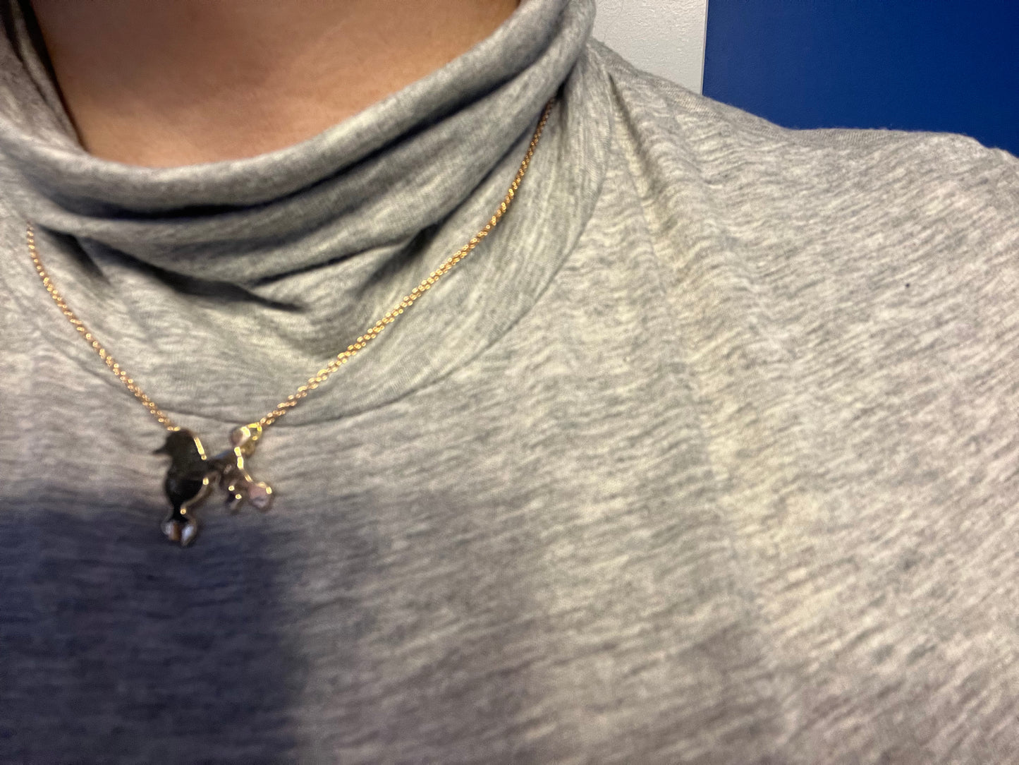Gold tone poodle necklace