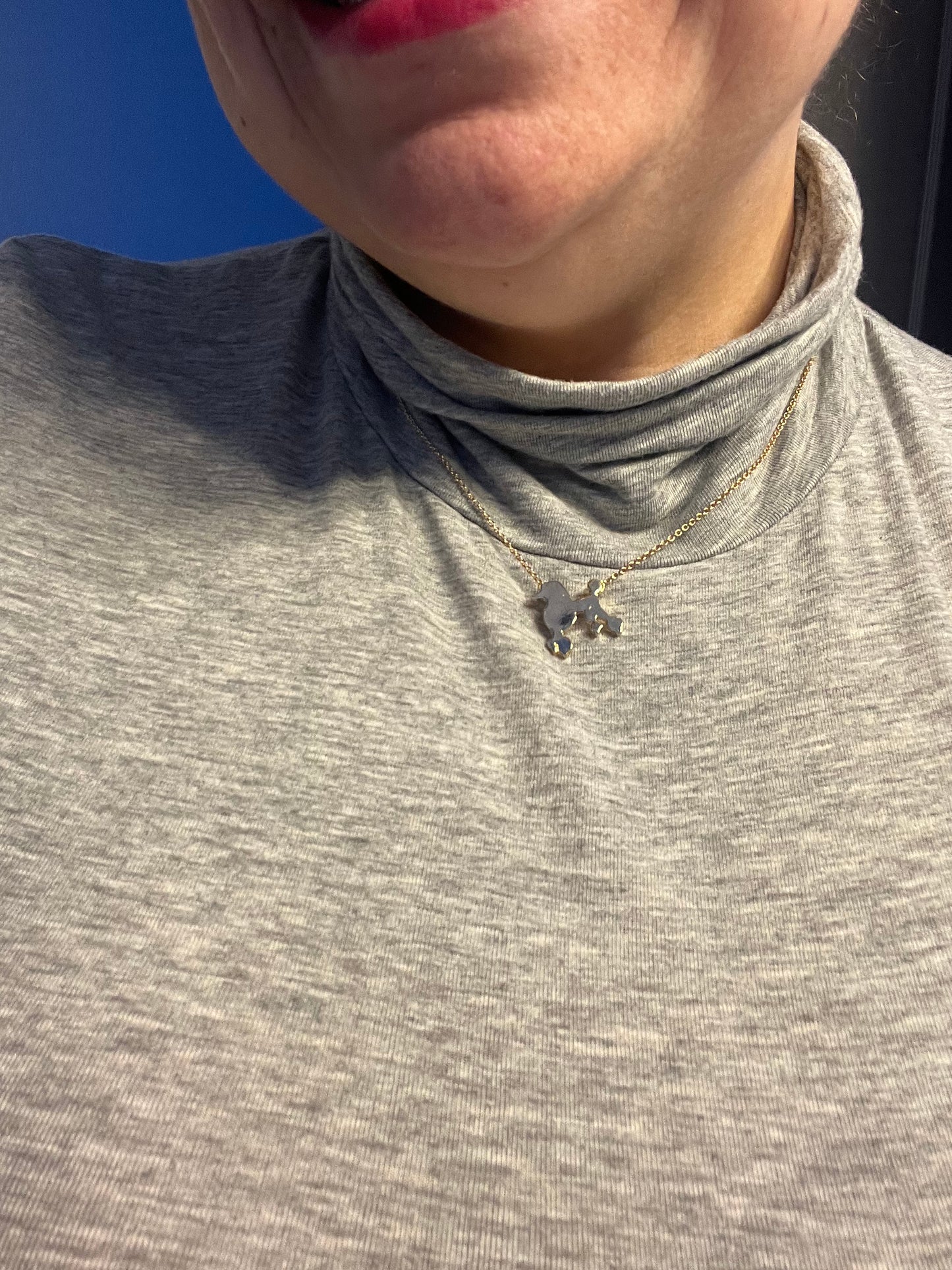 Gold tone poodle necklace