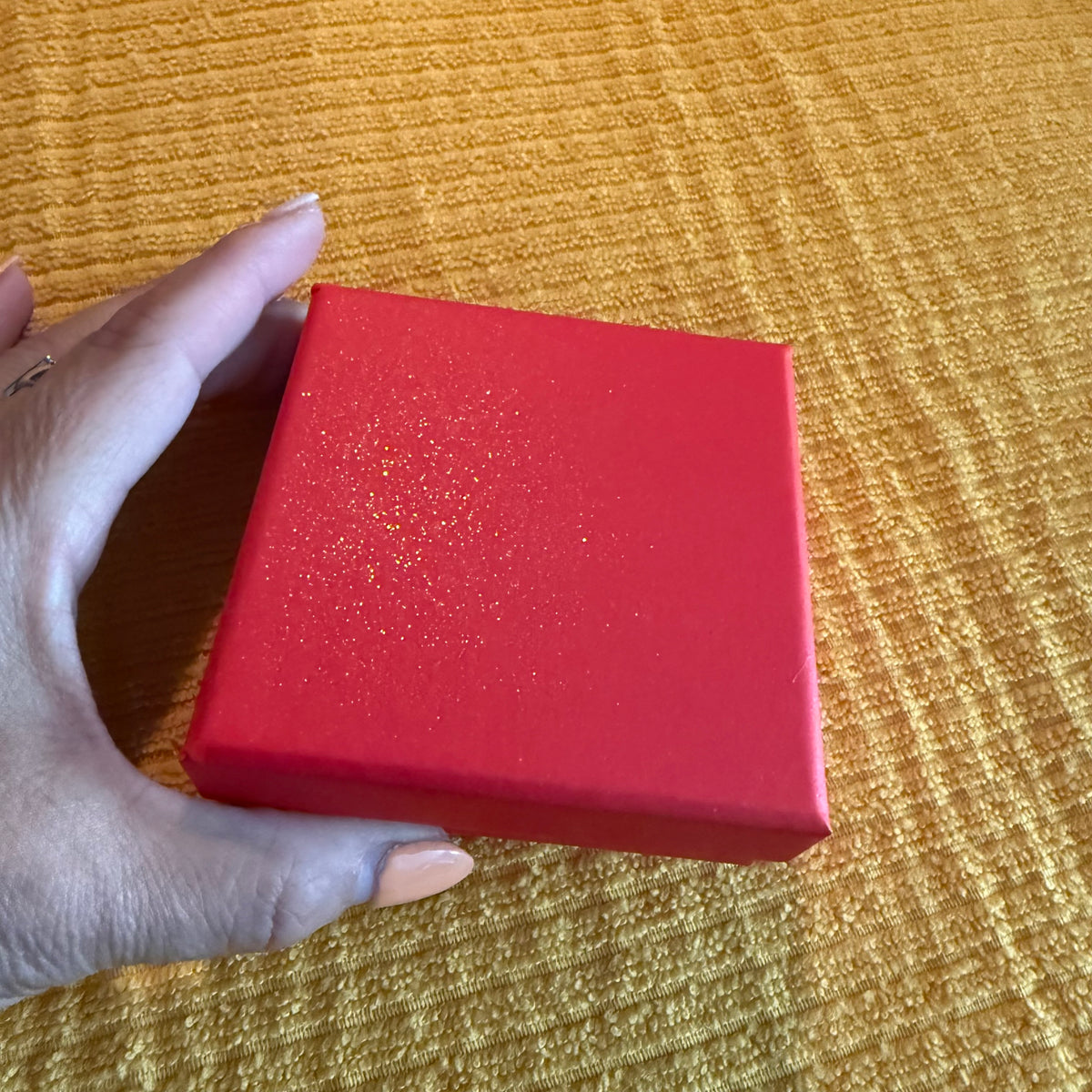 Red gift box with gold shimmer