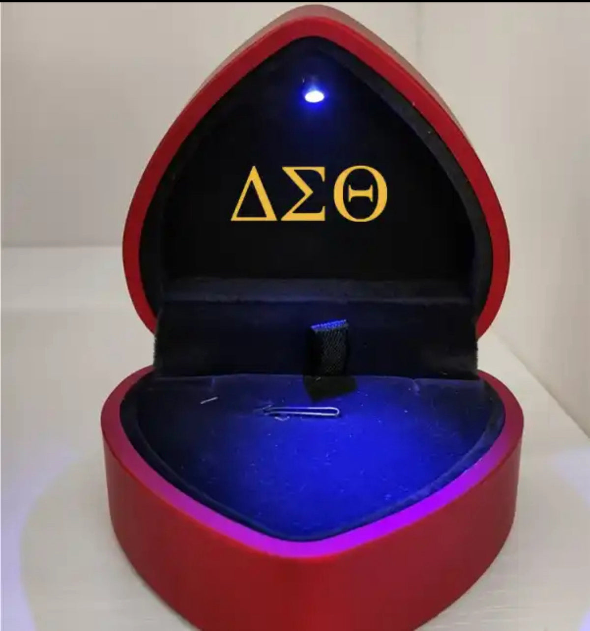 Red gift box with gold shimmer